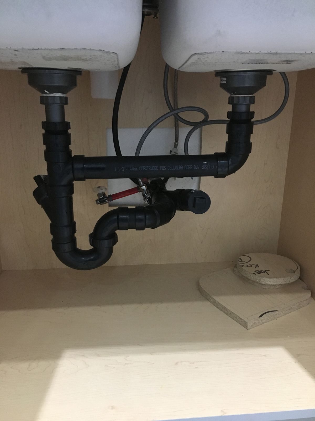 Double kitchen sink drain and trap rebuilt in black ABS under the sink